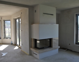 Nasze realizacje - Nowoczesne NR-N-238 - Nowoczesny kominek z wkładem Spartherm Varia 2Lh80. Obudowa wykończona trawertynem klasycznym. projekt: Marcin Deręgowski